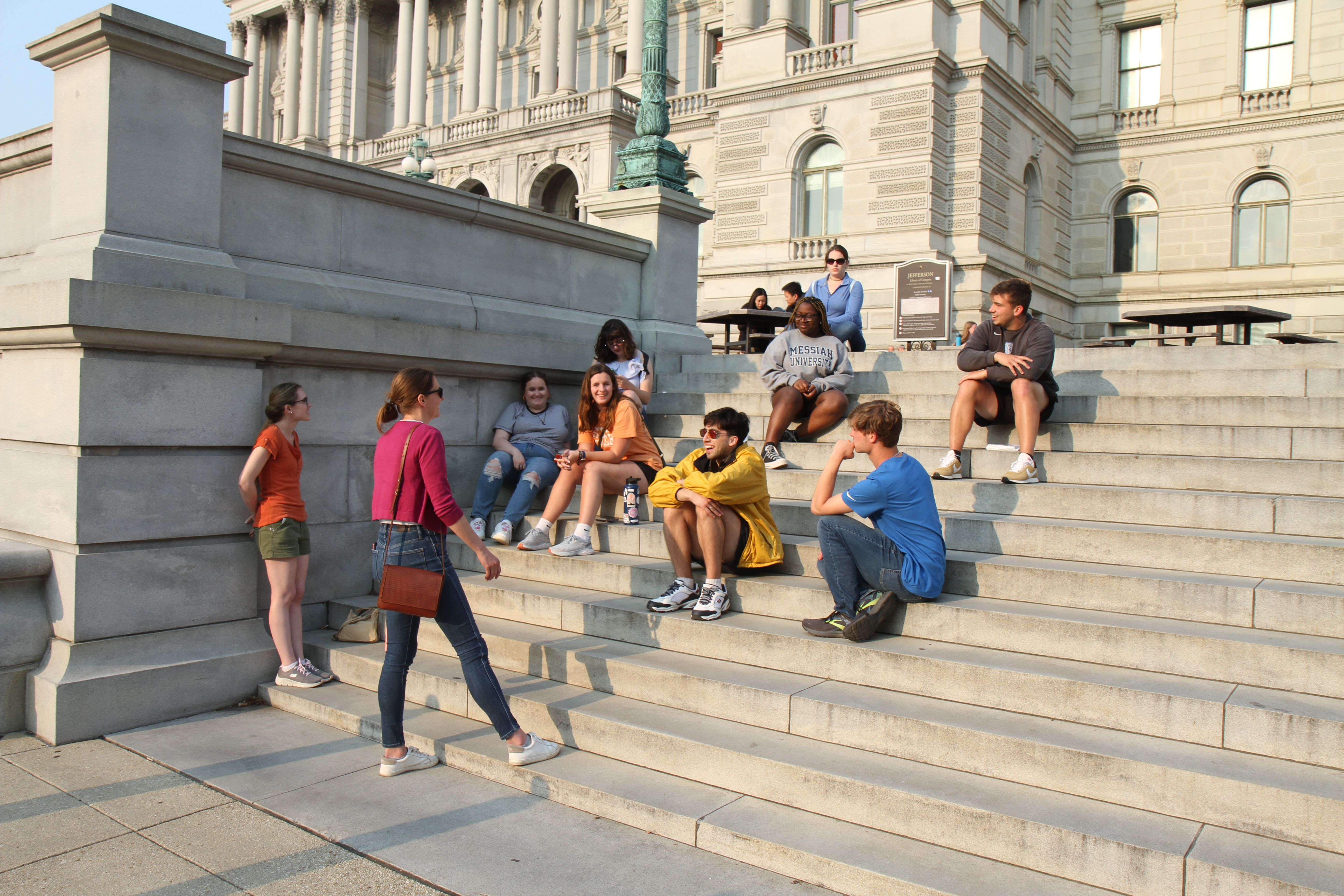 Alumna Sarah teaches Messiah University students on the steps of the Library of Congress during a 3-week history course in Washington D.C. in May/June 2023.